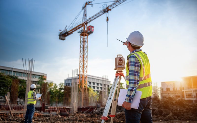 Surveyor equipment. Surveyorâ€™s telescope at construction site or Surveying for making contour plans is a graphical representation of the lay of the land startup construction work.